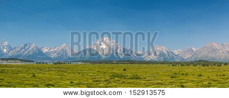 The amazing Teton mountains above Jackson Lake in Wyoming USA. - panorama image