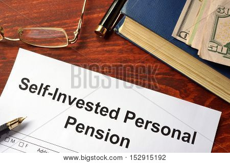 Self-Invested Personal Pension (SIPP) form on an office table.