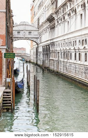 The Bridge of Sighs (Ponte dei Sospiri ) with gondola station in Venice (Italy)