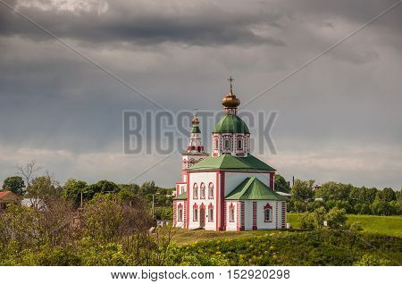 View of the Church of Elijah the Prophet on Ivanova mountain or Elias Church before the storm in Suzdal Russia. Golden Ring of Russia.