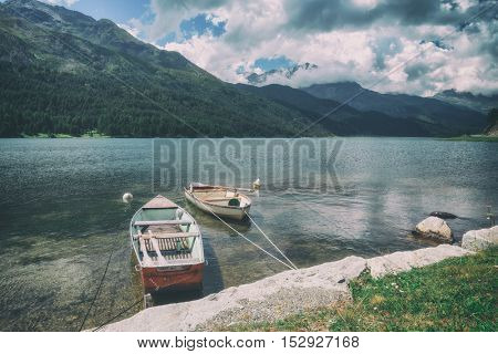 Amazing sunny day at Champferersee lake in the Swiss Alps. Silvaplana village, Switzerland, Europe. Toned like Instagram filter