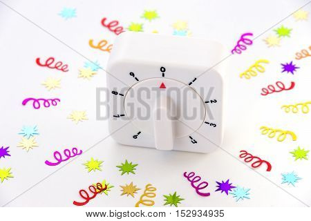 A countdown timer at zero with stars and spiral confetti bursting out around it
