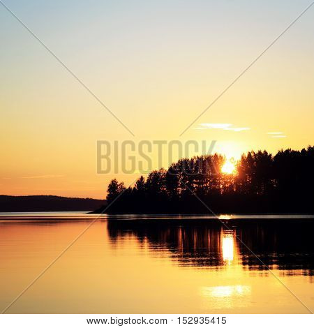 Sunset at Kenozero lake. Beautiful northern landscape. Aged photo. Wild nature of Russian North. Vintage photo. Kenozersky National Park (UNESCO Biosphere Reserve) Russia.