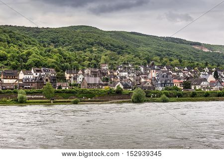 Trechtingshausen Germany - May 23 2016: Trechtingshausen village in the Unesco World Heritage area of the Rhine Valley in cloudy weather at the Mainz-Bingen district in Rhineland-Palatinate Germany.