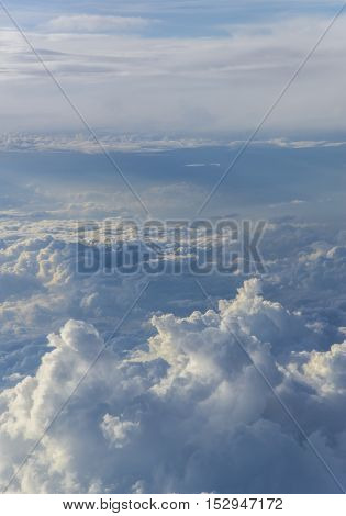 clouds sky sunset. view from the window of an airplane flying in the clouds