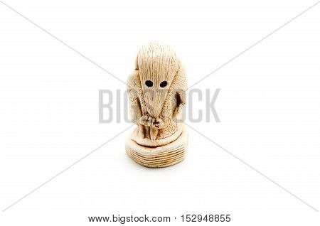 Netsuke of woman isolated on white background.