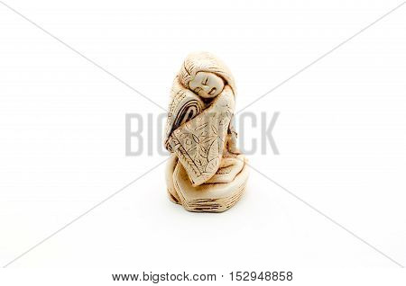 Netsuke of woman isolated on white background.