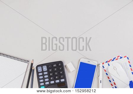 Top view copy space at middle with calculator mobile gridbook business tools and equipment flat layout display of photography for montage your product or display.