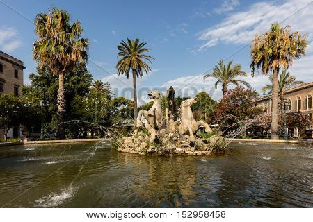 TRAPANI ITALY - AUGUST 11 2016: Triton fountain on the Piazza Vittorio Emanuele II built in 1951 by Domenico Li Muli.