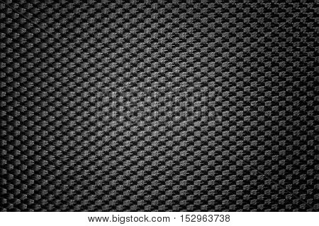 Black symmetrical synthetic fiber texture with vignette.