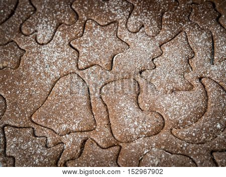 Gingerbread dough background for Christmas cookies, gingerman, boot, star
