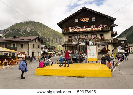 Livigno, Italy - August 1: Tourists Shopping On The Streets Of Duty-free Area On 1 August 2016 In Li