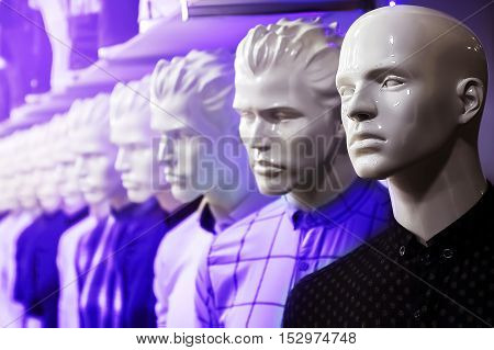 dummy in the department of menswear in neon light