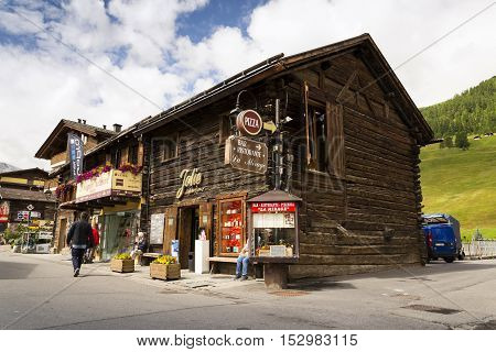 Livigno, Italy - August 1: Tourists Shopping On The Streets Of Duty-free Area On 1 August 2016 In Li