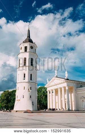 Vilnius, Lithuania. Cathedral Basilica Of St. Stanislaus And St. Vladislav With The Bell Tower In Summer Sunny Day,  Blue Cloudy Sky Background. Roman Catholic Cathedral At The Cathedral Square.