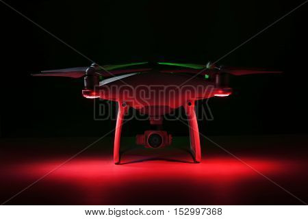 Varna Bulgaria - October 17 2016: Flying drone quadcopter Dji Phantom 4 Optimized Vision Positioning System isolated on black