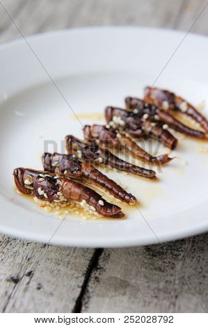 Roasted Grasshoppers Coated With Honey And Sesame Seeds