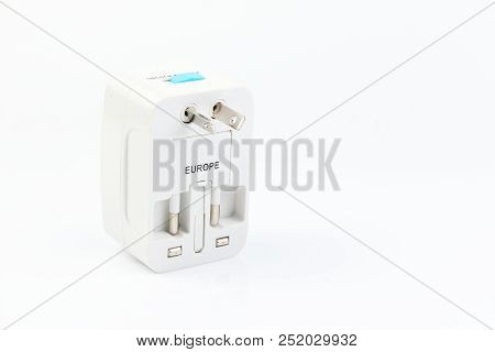 Universal Travel Adapter Plug. Isolated On White Background. For Travelers To Many Countries. Need A