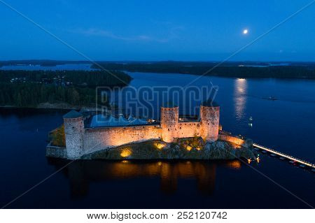 Olavinlinna Fortress In The July Night (aerial Survey). Savonlinna, Finland