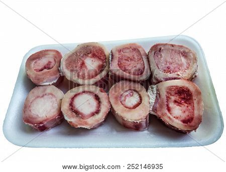 Pieces Or Slices Of Big Marrowbone With Few Drops Of Blood And Meat On Side. Raw Cut Into Pieces Lam