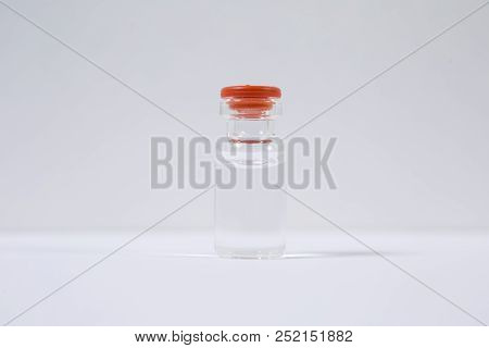 Group Of Vials With Medication On Blue Methacrylate Table. Horizontal Composition.
