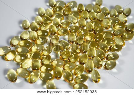 Fish Oil Supplement Capsules Isolated On White Background