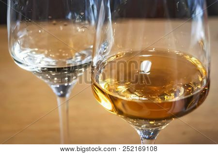 Two Wine Glasses With Two Different Kinds Of Bulgarian Rakia Alcoholic Fruit Brandy. Rakia Close Up 
