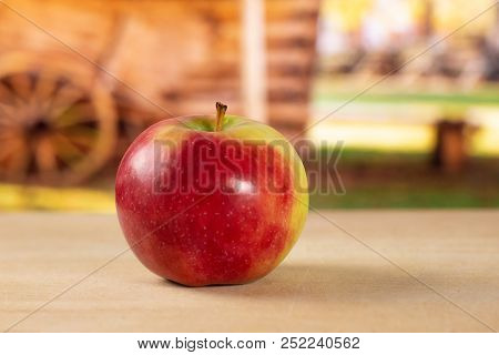 One Whole Fresh Red Apple James Grieve Variety With Cart In Background