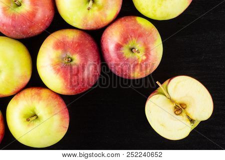 Lot Of Whole One Half Of Fresh Red Apple James Grieve Variety Flatlay On Black Wood