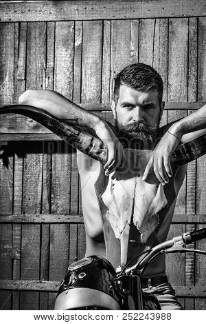 Bearded Man Hipster Biker With Beard And Moustache Sexy Muscular Male With Bare Torso Sits On Motorc