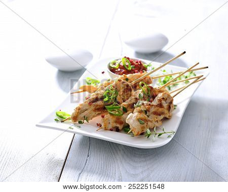 Barbecued Chicken Skewers With Sun-dried Tomato Sauce.
