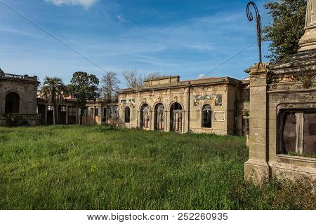Livorno, Italy - April 2018: Empty Room With A Toilet In An Old Prison.