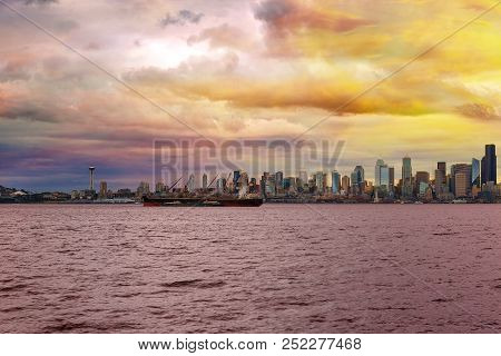 Seattle Washington City Skyline Along Elliot Bay In Puget Sound From Alki Beach During Sunset