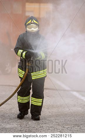 Italia, It, Italy - May 10, 2018: Italian Fireman Uses The Hydrant With Foam During  An Exercise In 
