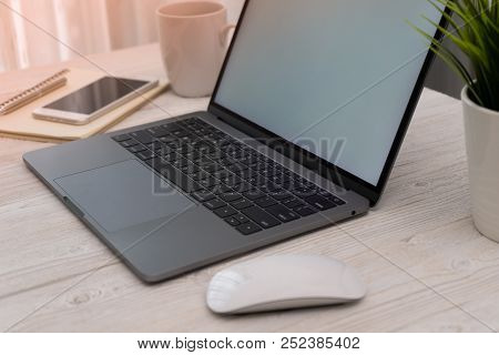 Side View Shopping Online On Laptop And Smartphone And Working Wooden Desk Business With Coffee, A L