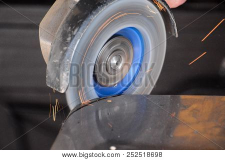 Cutting Steel With Angle Grinder At Car Service