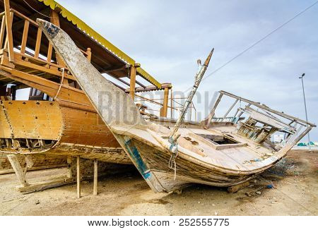 Old destroyed boats on shore near Dibba Port, UAE