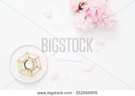 Feminine Wedding Or Birthday Flat Lay Composition With Peonies Floral Bouquet And Candle. Blank Pape