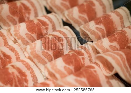 Pork Raw Meat Slides On Dish At Grill Buffet Restaurant