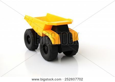 Isolated Toy Truck With White Background In Yellow And Black Colors