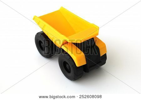 Isolated Toy Truck With White Background In Yellow And Black Colors