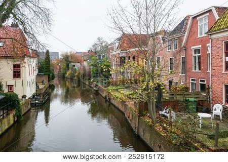 Houses Along The Canal Damsterdiep In The Village Appingedam In The Netherlands