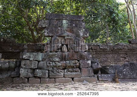 Ancient Ruins Of Krol Ko Temple In Angkor Wat Complex, Cambodia. Stone Bas-relief Restoration. Stone