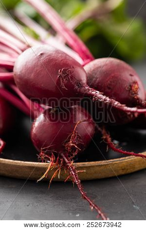 Beet, Beetroot Bunch On Wooden Plate On Grey Stone Background. Copy Space. .