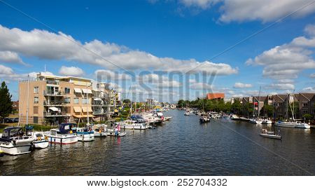 Sneek, Friesland, The Netherlands - August 5, 2018; Ships are anchored in the Sneek Marina during the Sneekweek 2018 in Sneek, Friesland, the Netherlands