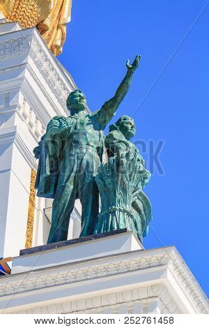 Moscow, Russia - August 01, 2018: Sculptural Group Of Worker And Collective Farmer Against Blue Sky 