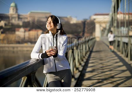 Young Athlete Woman With Mobile Phone Outdoor