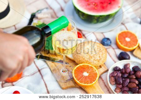 Summer Picnic Basket On The Green Grass. Food And Drink Concept. Friends Party Time