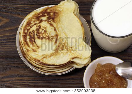 Pancakes With Honey On A Wooden Table. Glass Of Milk. Healthy Food. Breakfast.