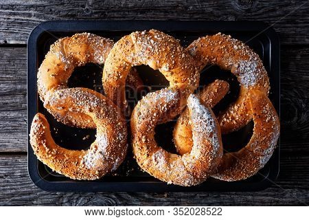 Kifli Of Kipfel Austrian Crescent-shaped Sweet Pastry Sprinkled With Nuts And Icing Sugar, Served On